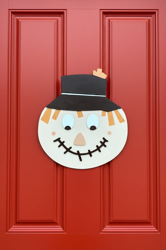 Scarecrow face decoration on a door