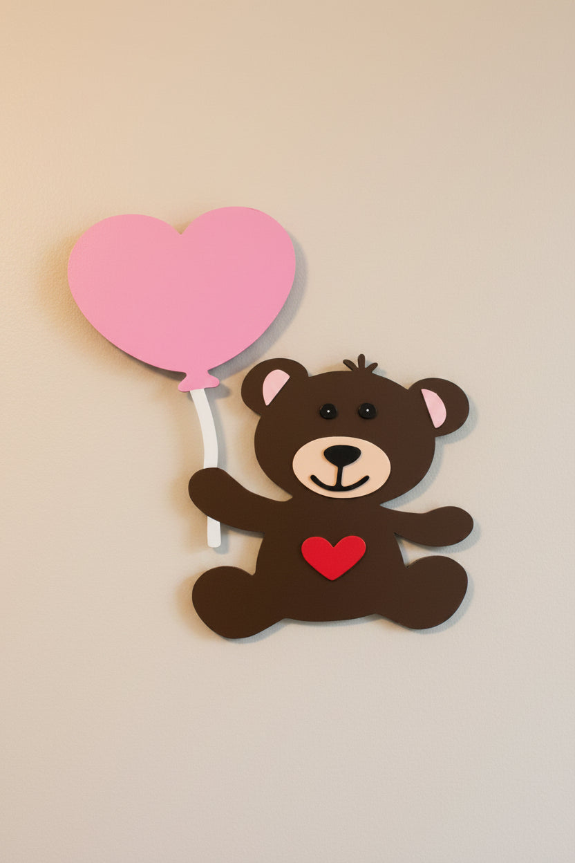 Decorative bear with a heart balloon on a door